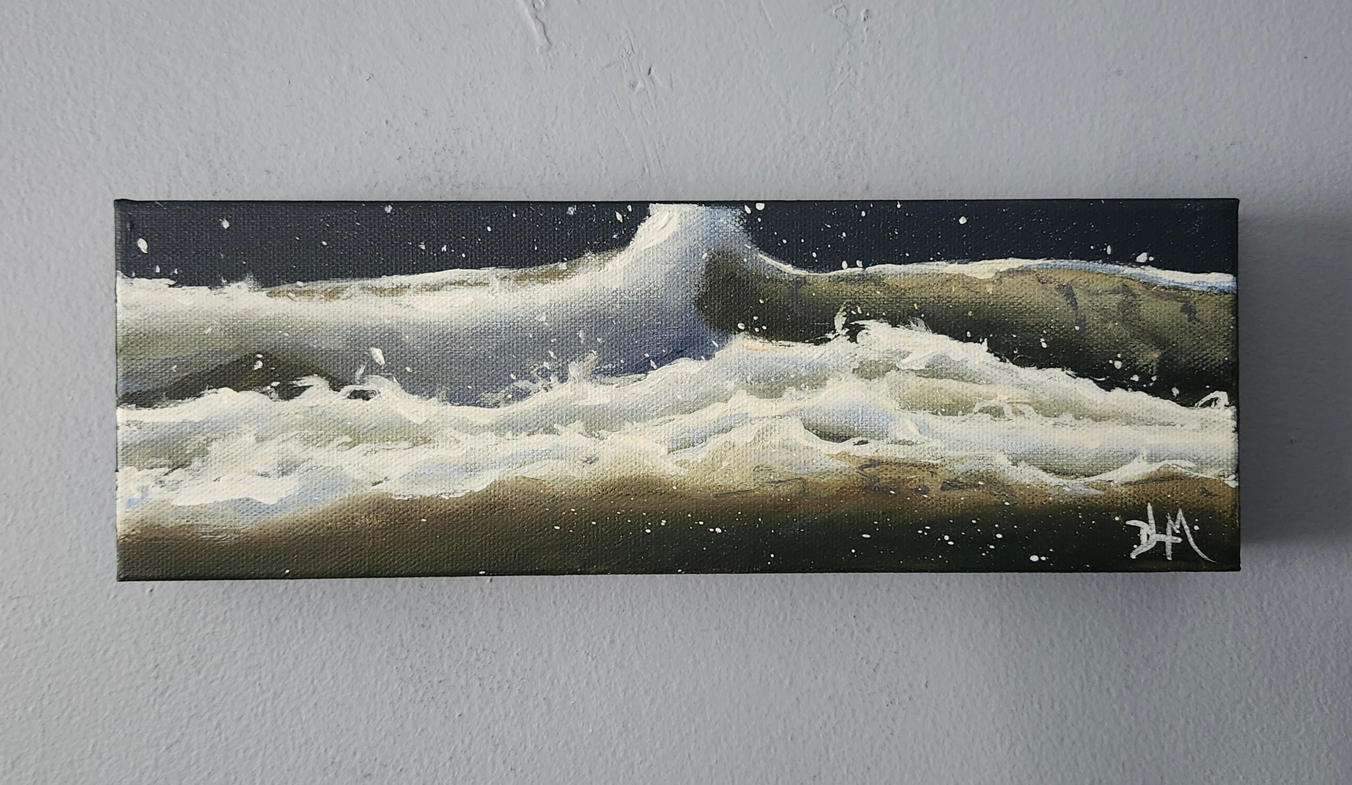 Eye level view of the acrylic painting hanging on a wall.