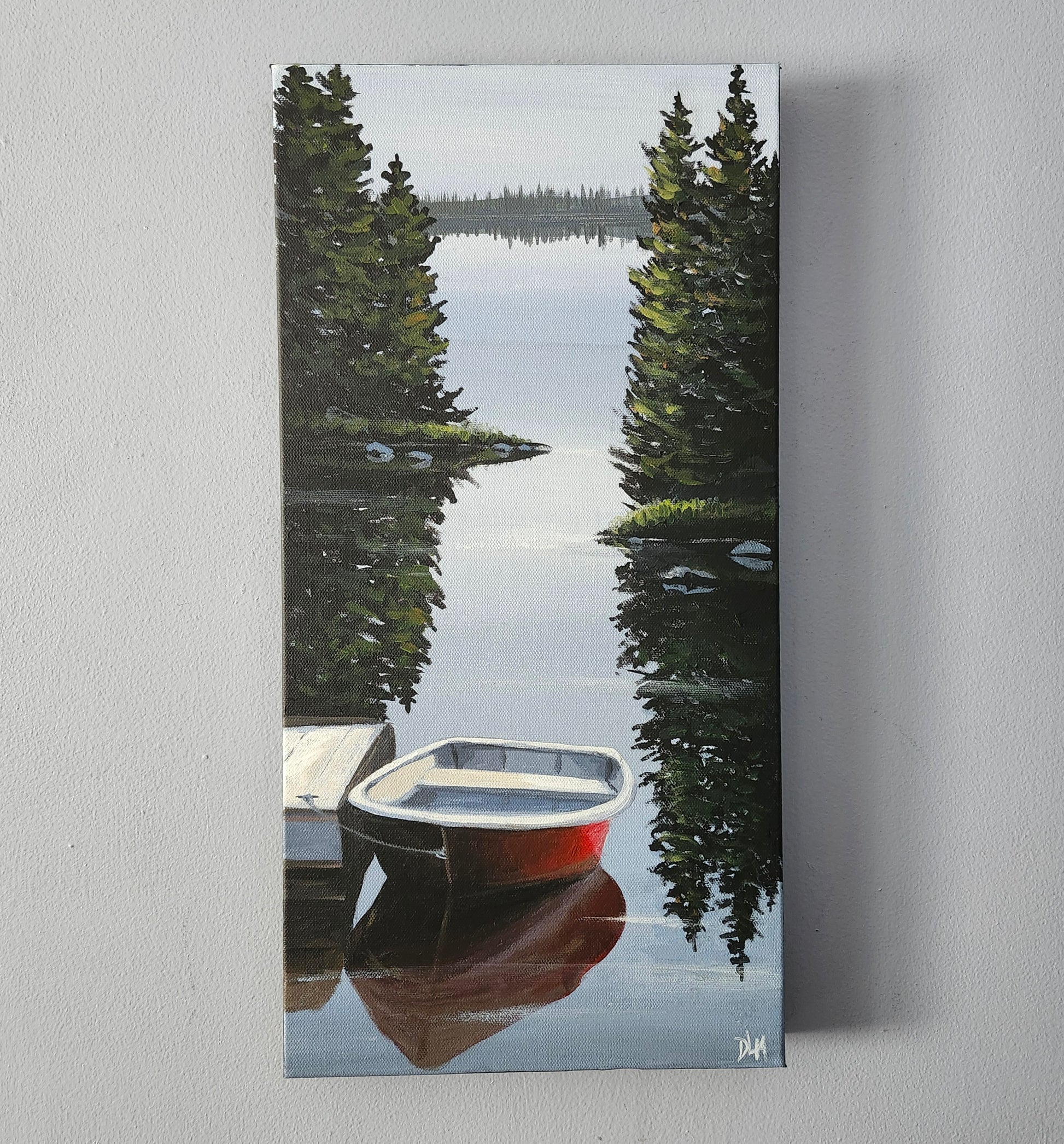 A straight on perspective of the acrylic painting hanging on a wall.